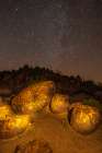 USA-Arizona-Painted Rock Petroglyph Site Illuminated rock petroglyphs and starry night sky Art Print